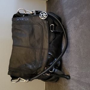 The Sak black leather saddle bag style handbag